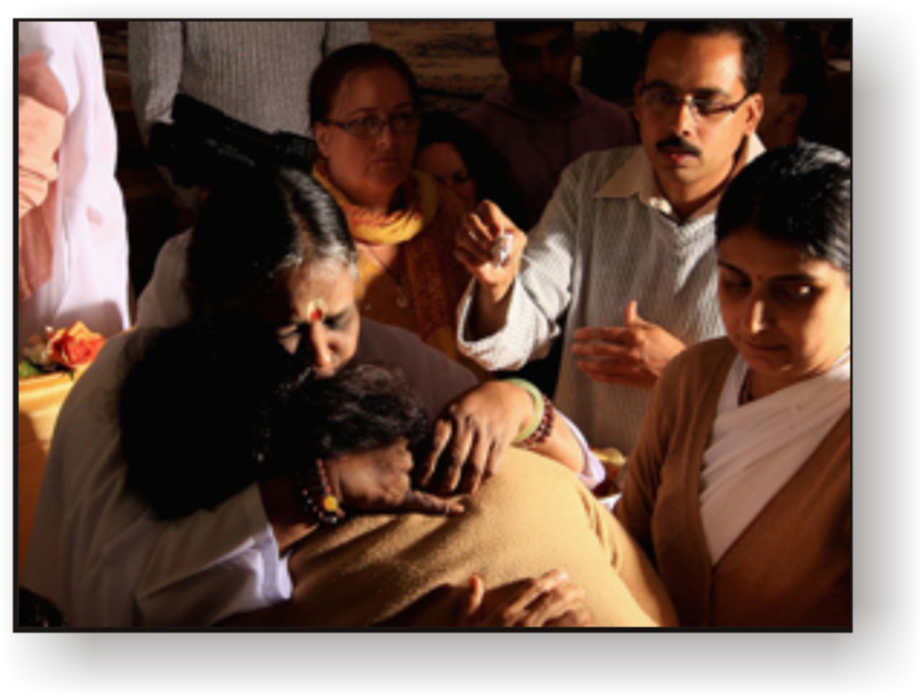 Amma hugging people